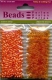 12130-3007 Reisperlen oval transparent & opak orange